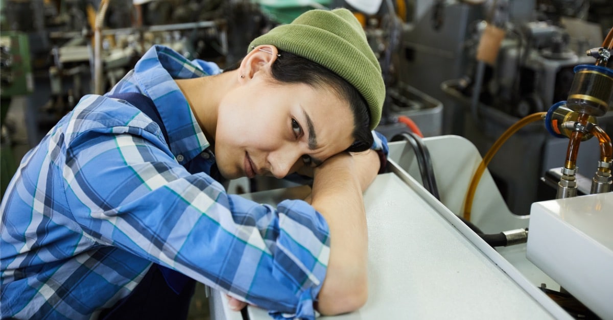 emale factory prescriptive maintenance worker holding head and looking confusedholding head and looking confused