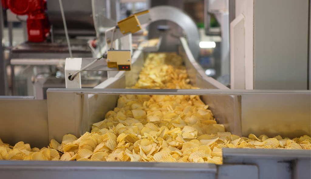 Chips coming down a manufacturing chute.