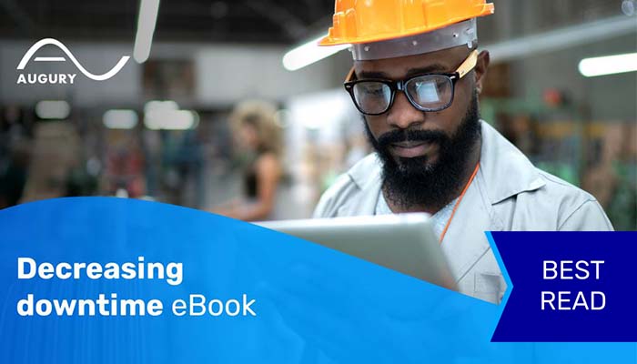 Man in factory looking at his iPad.