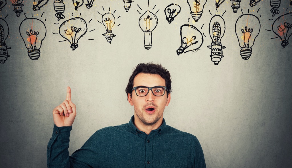 Surprised businessmen surrounded by idea lightbulbs. Yes, Augury's AI is amazing.