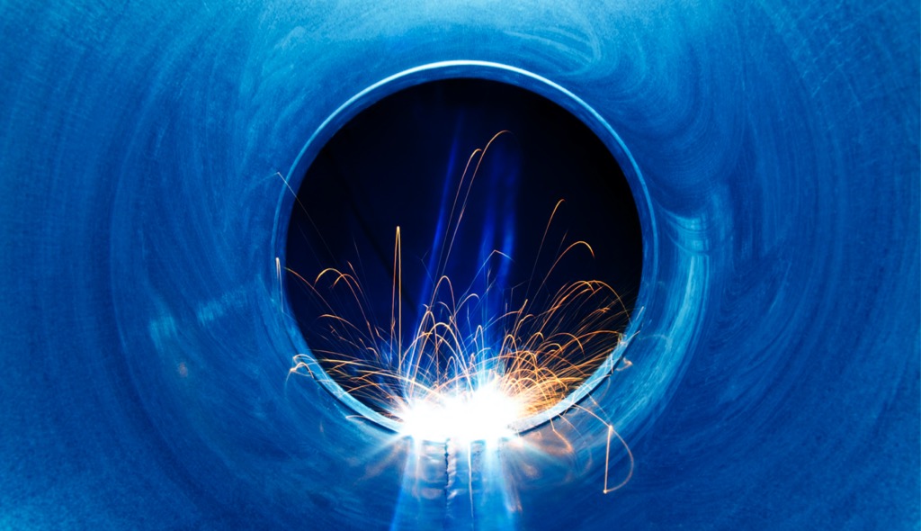 Welding at the end of a vanishing point suggesting a promising future.